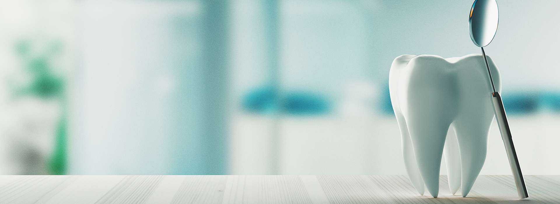 A small toy dentist sitting on a white countertop with a toothbrush nearby.